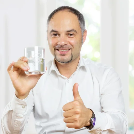 SanusLife · Portrait with a glass of water · Brand image